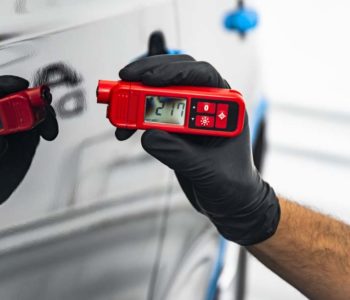 Measuring thickness of the car paint coating with paint thickness gauge